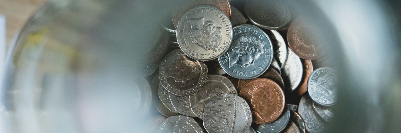 silver round coins on blue round container
